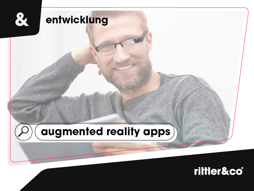 Grafikdesign für Rittler und Co für die Entwicklung mit einem Mann mit Brille im Hintergrund